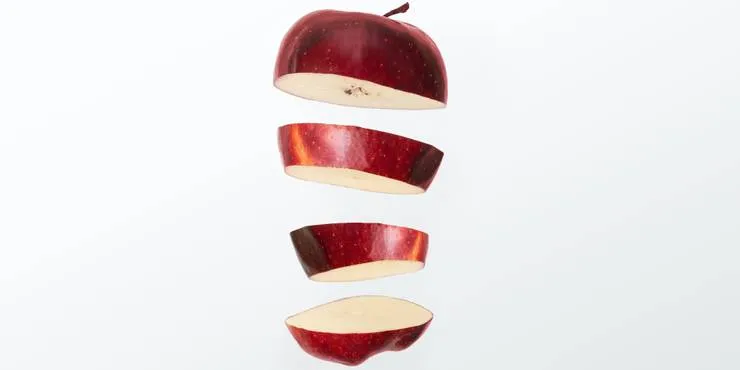 An exploded view of a red apple cut horizontally