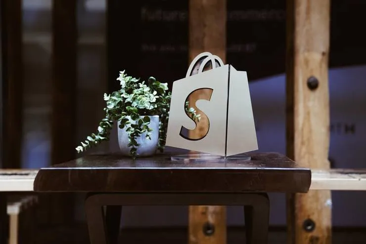 Shopify Logo Window With Plant